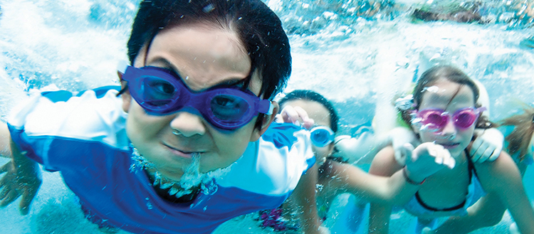 Kids swimming under water