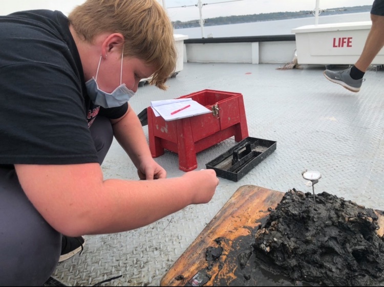 student inspects Seneca lake finding ￼